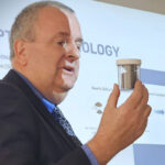 HPQ Silicon CEO Bernard Tourillon holding a container with the first samples of Silicon